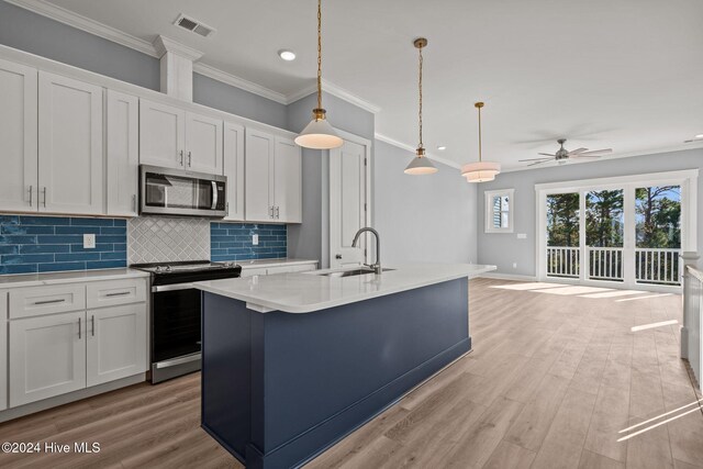 kitchen featuring black / electric stove, white cabinetry, light hardwood / wood-style flooring, and light stone countertops