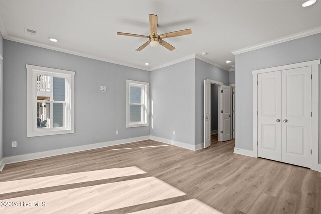 bathroom with vanity, a shower with door, and crown molding