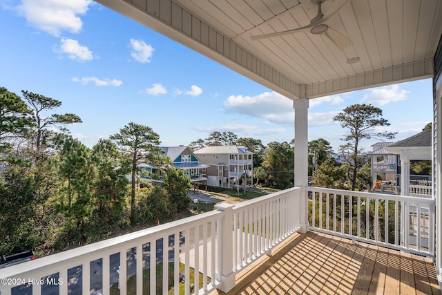 wooden terrace featuring ceiling fan