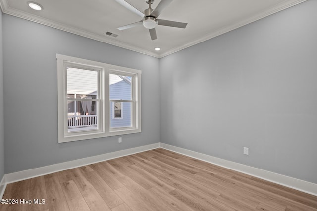 spare room featuring light hardwood / wood-style flooring, ceiling fan, and crown molding