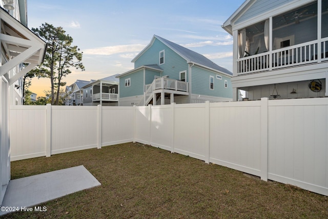 view of yard at dusk