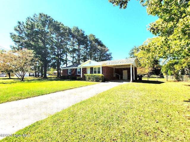 ranch-style home with a front yard and a carport