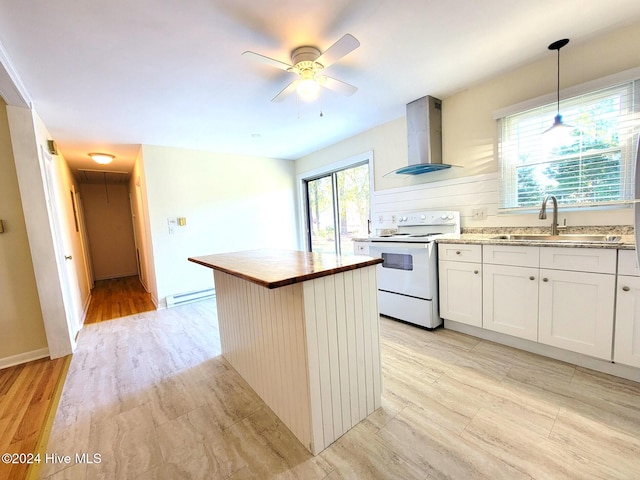 kitchen featuring white electric range oven, sink, wall chimney range hood, a center island, and hanging light fixtures