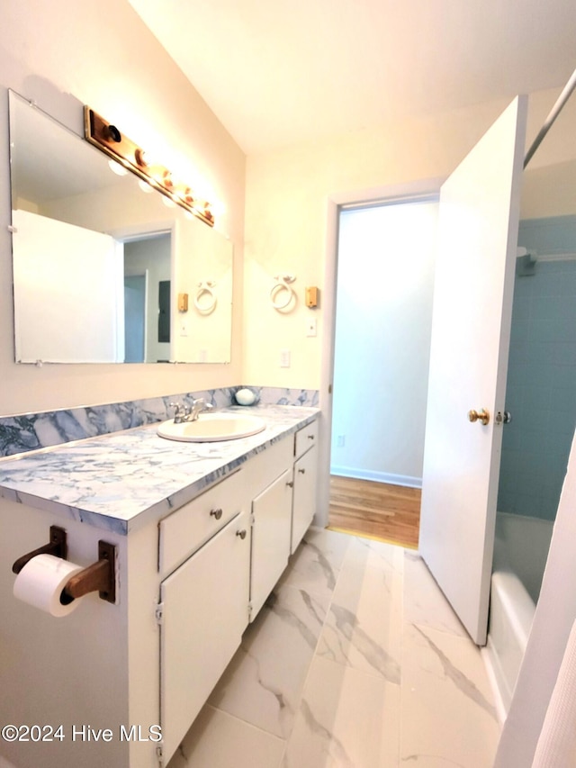 bathroom with vanity and wood-type flooring