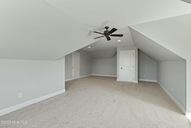 additional living space featuring baseboards, a ceiling fan, recessed lighting, carpet flooring, and lofted ceiling
