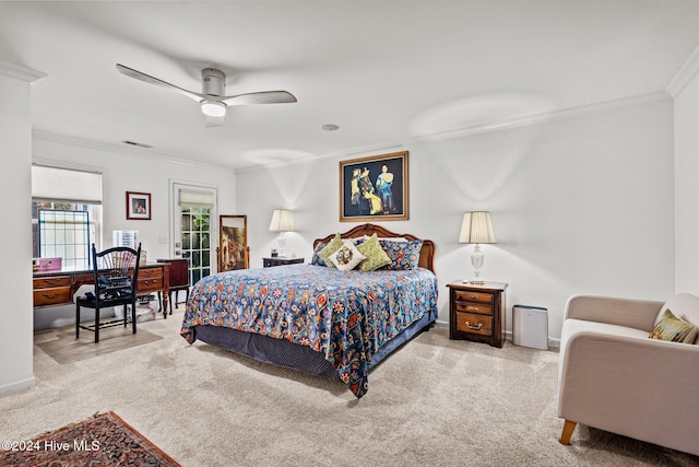 bedroom featuring ceiling fan, crown molding, and light carpet