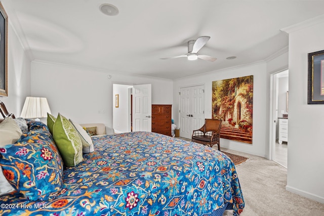 bedroom featuring a closet, ceiling fan, crown molding, and carpet floors