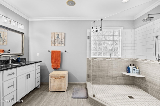 bathroom with crown molding, vanity, wood-type flooring, and a shower with shower door