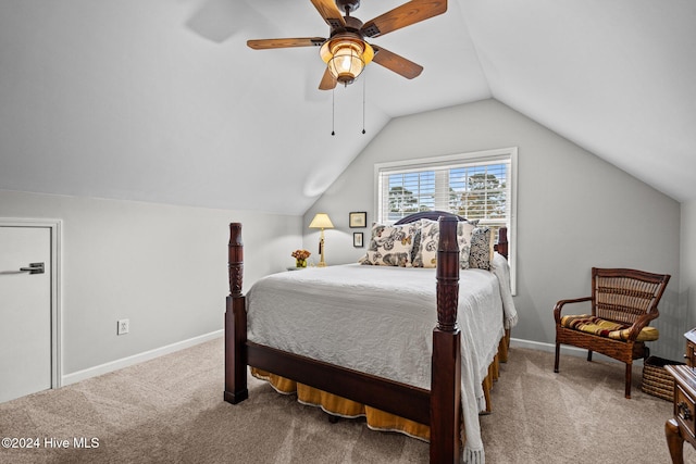 carpeted bedroom with ceiling fan and lofted ceiling