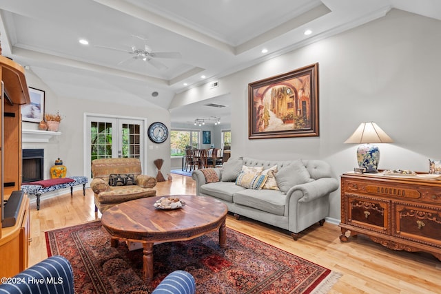 living room with wood-type flooring, french doors, ceiling fan, and ornamental molding