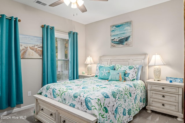 bedroom with ceiling fan and light carpet