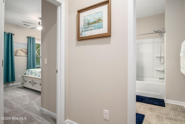 bathroom featuring shower / bath combination and ceiling fan