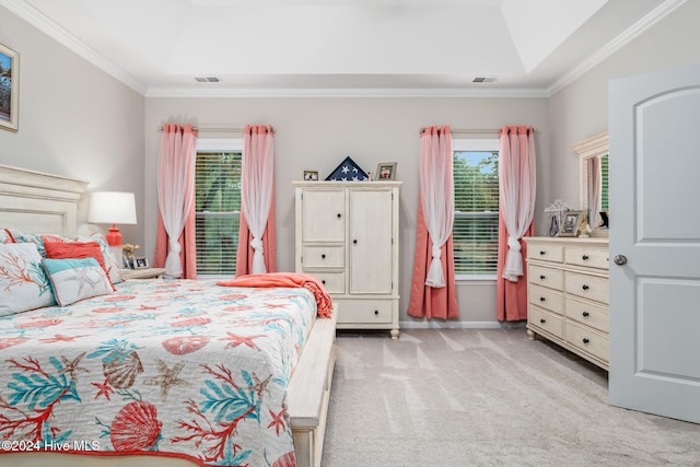 bedroom with light colored carpet and crown molding