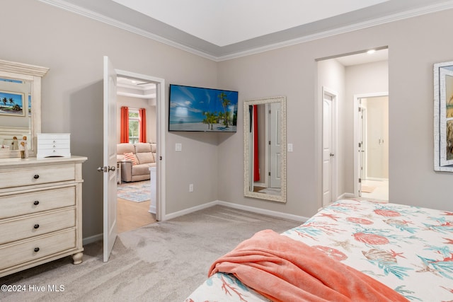 bedroom featuring light colored carpet and ornamental molding