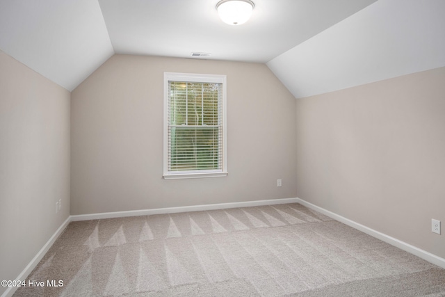 bonus room featuring carpet and lofted ceiling