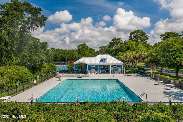 view of swimming pool featuring a patio