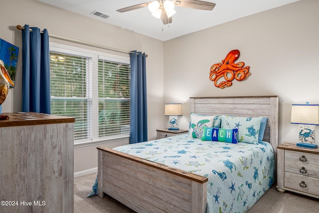 bedroom with ceiling fan and light carpet