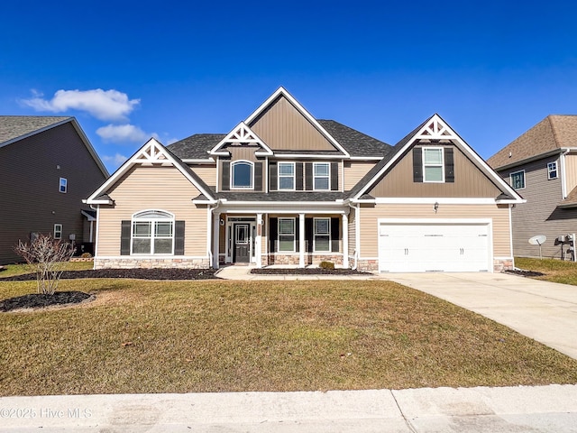 craftsman house featuring a porch, a garage, and a front yard