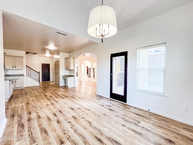 unfurnished living room featuring light hardwood / wood-style floors