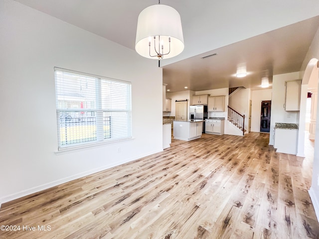 unfurnished living room with light hardwood / wood-style floors