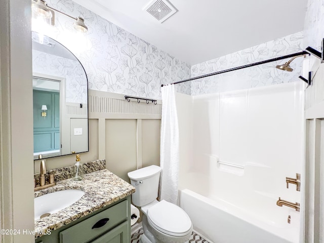 full bathroom with vanity, toilet, and shower / tub combo with curtain