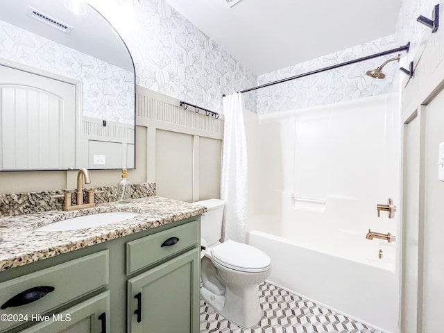 full bathroom featuring shower / tub combo with curtain, vanity, and toilet