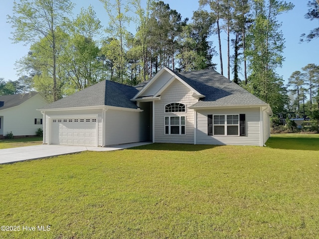view of front facade with concrete driveway, roof with shingles, a front lawn, and an attached garage
