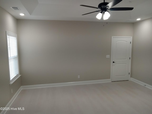 empty room with hardwood / wood-style floors and ceiling fan