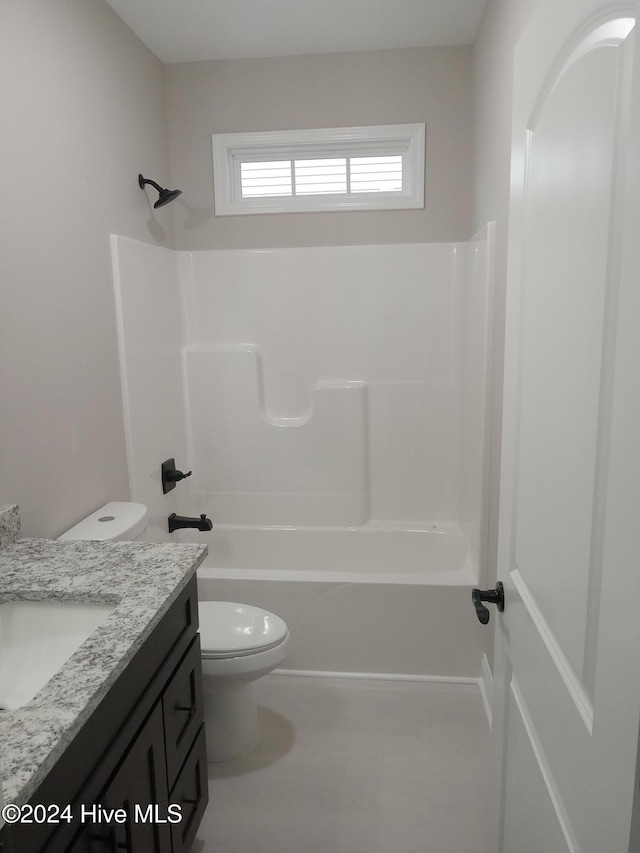 full bathroom with vanity,  shower combination, and toilet