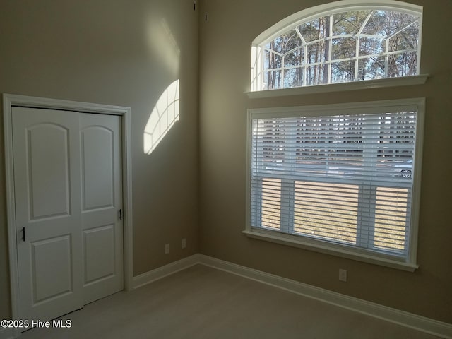 spare room with baseboards