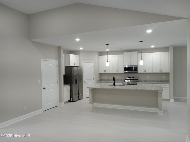 kitchen with recessed lighting, a kitchen island with sink, a sink, stainless steel appliances, and white cabinets