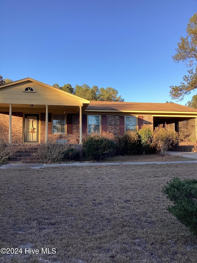 view of front facade with a carport