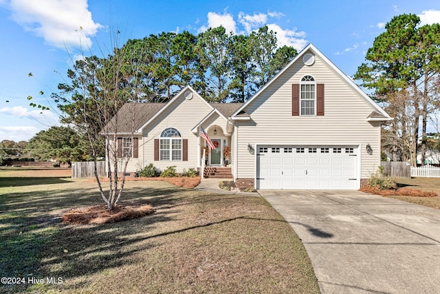 front of property featuring a front lawn and a garage