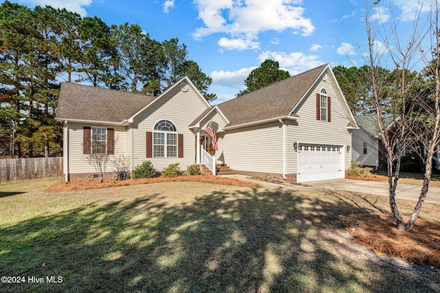 view of property with a front yard and a garage