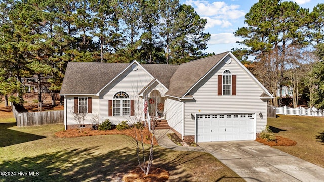 view of front of home featuring a garage and a front lawn