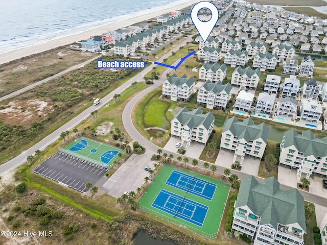 bird's eye view with a water view and a view of the beach