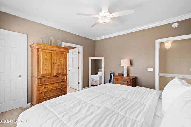 carpeted bedroom with ceiling fan and crown molding