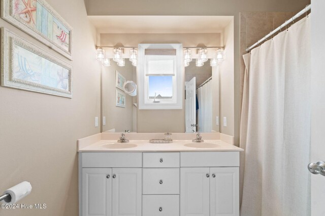 bathroom with vanity and walk in shower