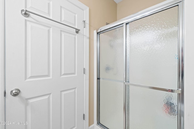 bathroom with an enclosed shower