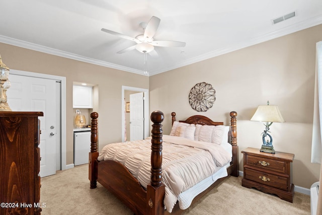 bedroom featuring ceiling fan, white refrigerator, ornamental molding, and light carpet