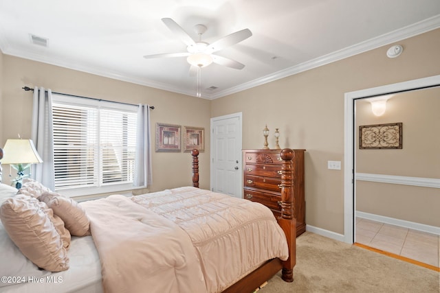 carpeted bedroom with ceiling fan and crown molding