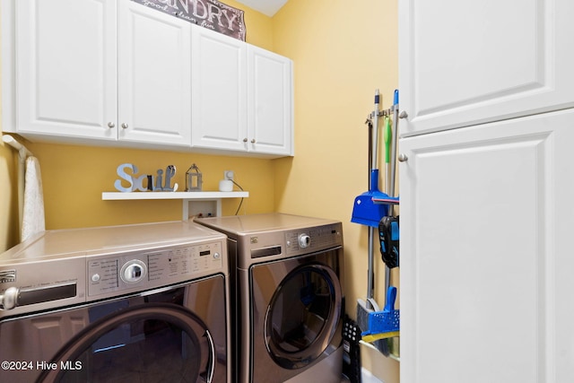 washroom with cabinets and independent washer and dryer