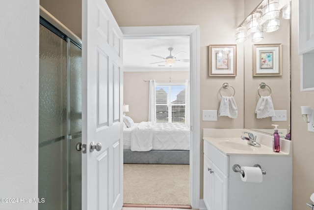 bathroom with vanity, ceiling fan, and walk in shower