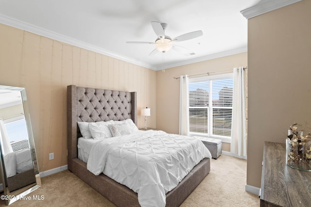 bedroom featuring ceiling fan, crown molding, and light carpet