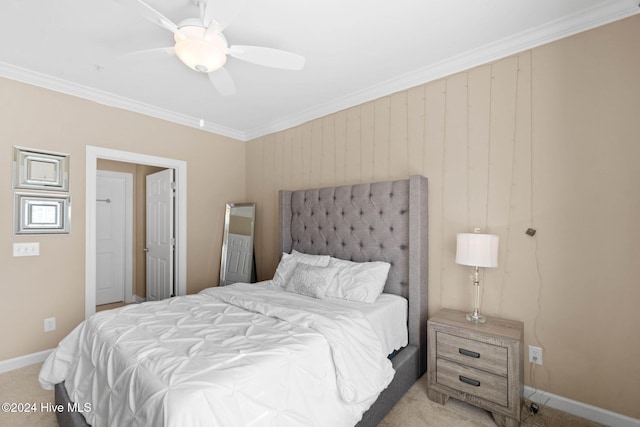 bedroom featuring ceiling fan, crown molding, and light carpet