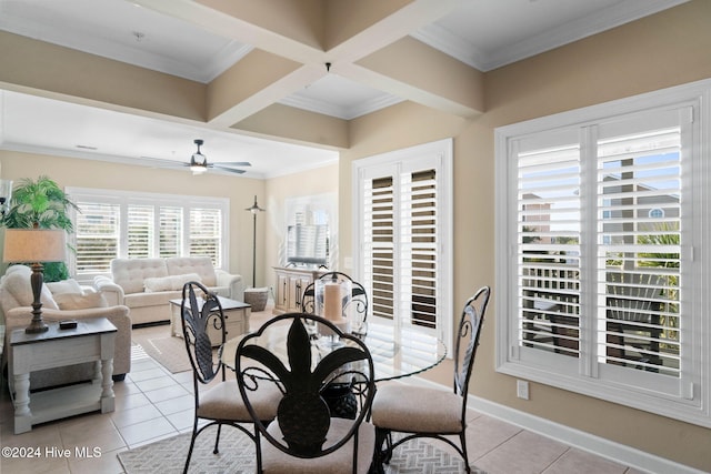 dining room with coffered ceiling, ceiling fan, light tile patterned floors, ornamental molding, and beamed ceiling