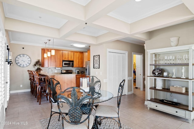 tiled dining space featuring beamed ceiling, ornamental molding, and coffered ceiling