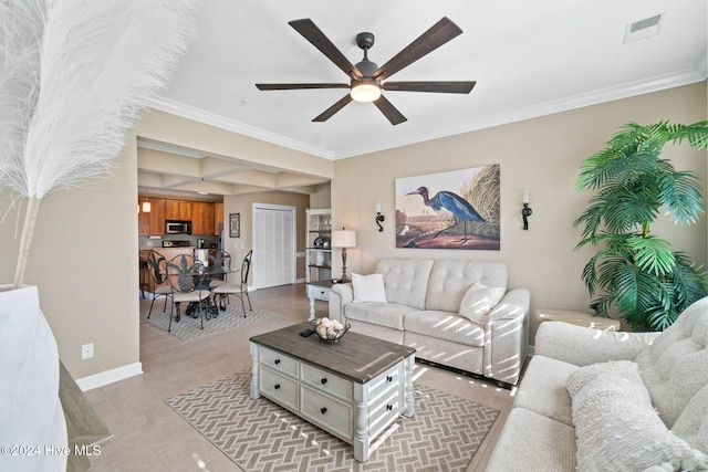 living room with ceiling fan, light tile patterned floors, and crown molding