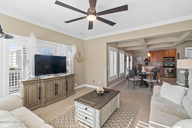 living room with a wealth of natural light, ornamental molding, and ceiling fan