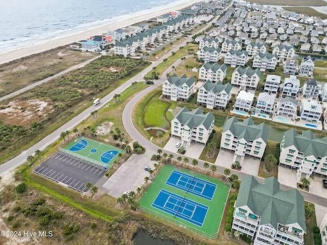 bird's eye view featuring a view of the beach and a water view